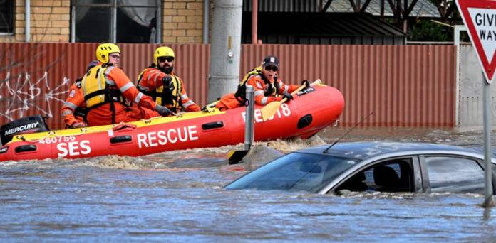 Flood victims stranded on roofs as downpours lash eastern Australia