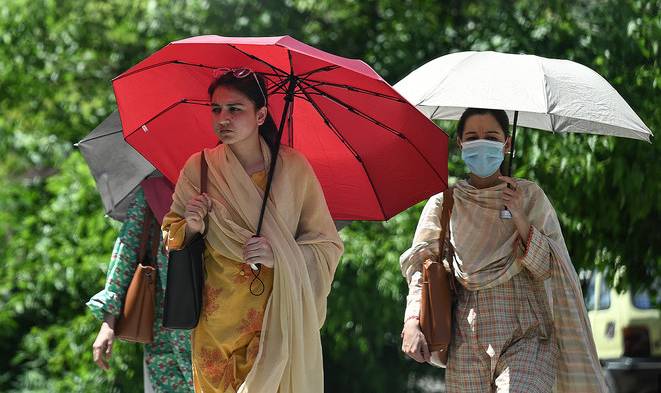 Hot, humid weather tests people’s patience as Met Office forecasts rain