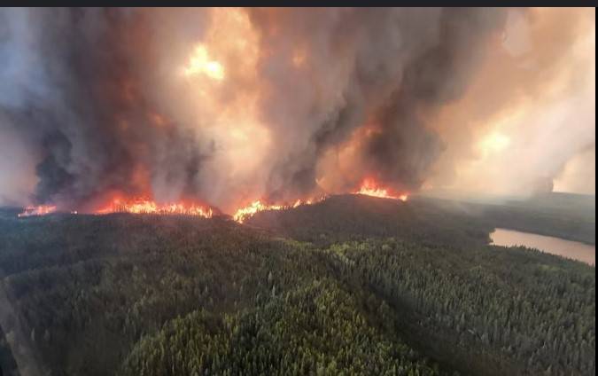 Thousands evacuate as Canada province declares wildfire emergency
