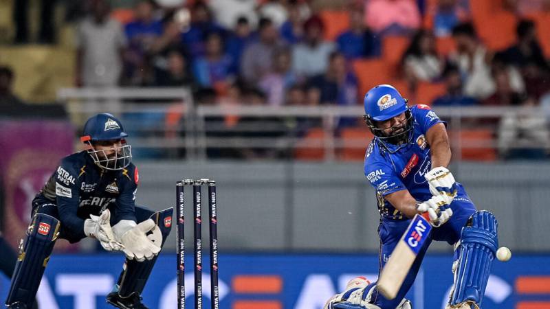 Rohit stars as Mumbai knock Gujarat out of IPL