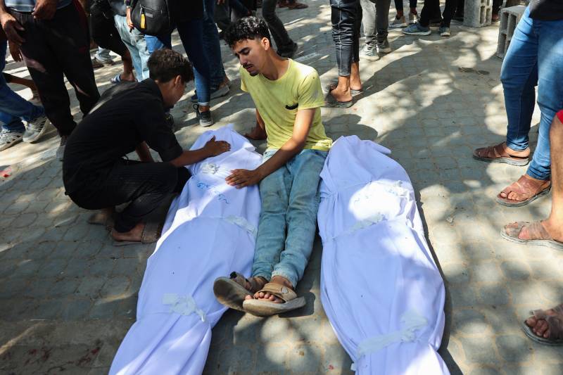 Gaza rescuers say Israeli forces kill over 50 as ceasefire calls mount
