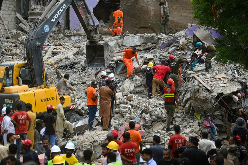 Search goes on as deaths from Karachi building collapse rise to 23 