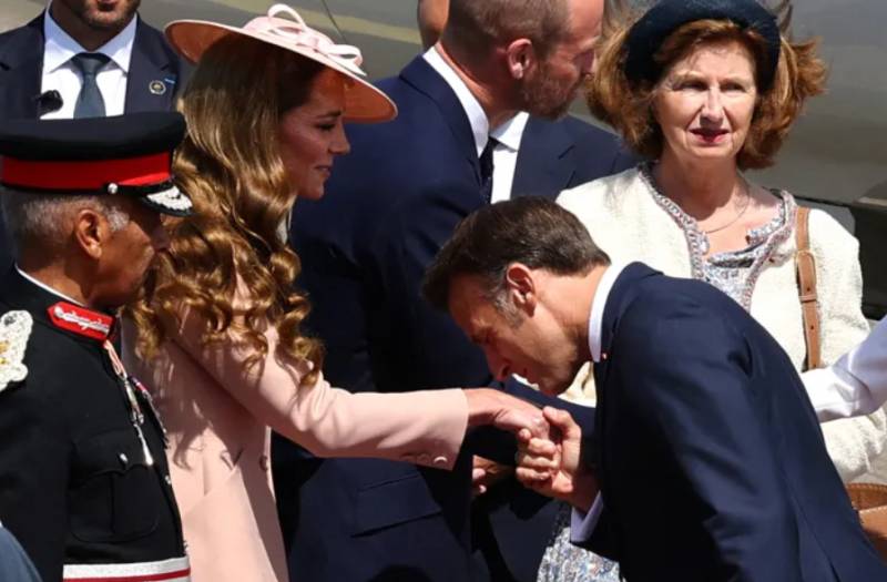 Did Macron break royal protocol with hand kiss to Kate Middleton?