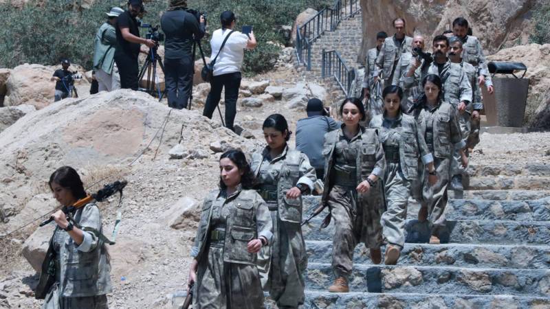 Kurdish PKK fighters destroy weapons at disarmament ceremony