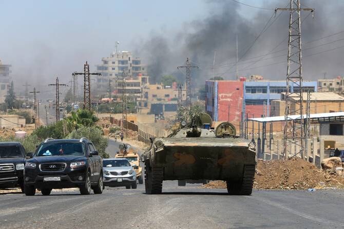 EU 'alarmed' by Syria clashes, urges protection of civilians