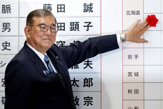 Japan PM hangs on after election debacle