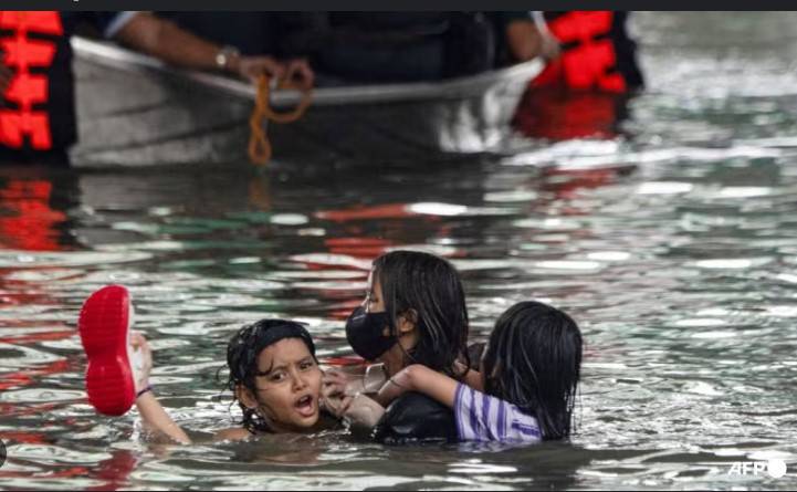 Philippines flooding displaces thousands, two missing