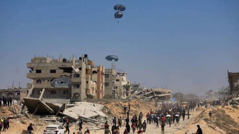 Food airdropped into Gaza as Israel says opening aid routes