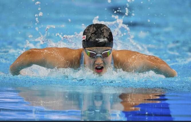 'Emotional' Yu, 12, celebrates historic world swimming medal