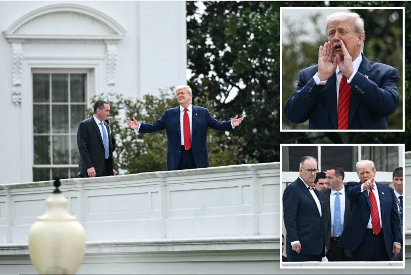 Standing on White House roof, Trump jokes about installing missiles