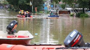 Tens of thousands evacuated as torrential rains drench south China