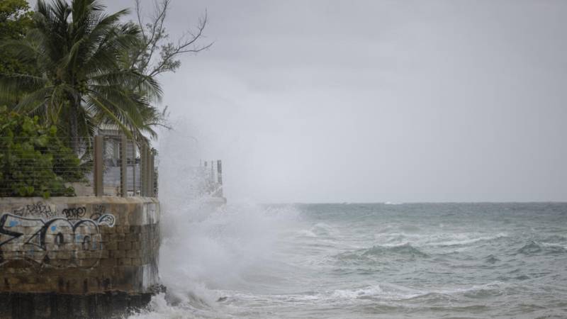Hurricane Erin intensifies offshore, lashes Caribbean with rain