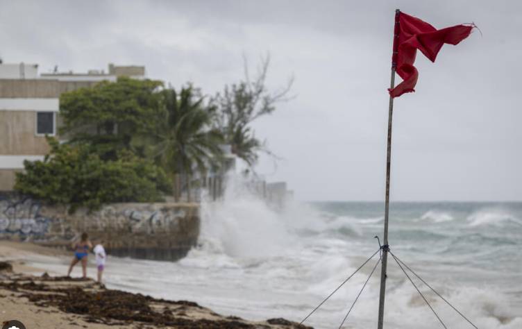 Downgraded Hurricane Erin lashes Caribbean with rain