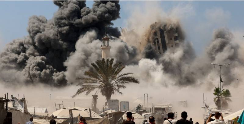 Israel flattens Gaza City high-rise as it tells residents to flee