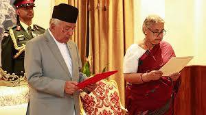 Nepal returns to calm as first woman PM takes charge, visits wounded