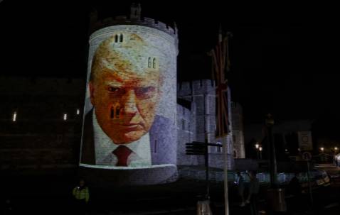 Protesters beam Epstein video at UK castle before Trump visit