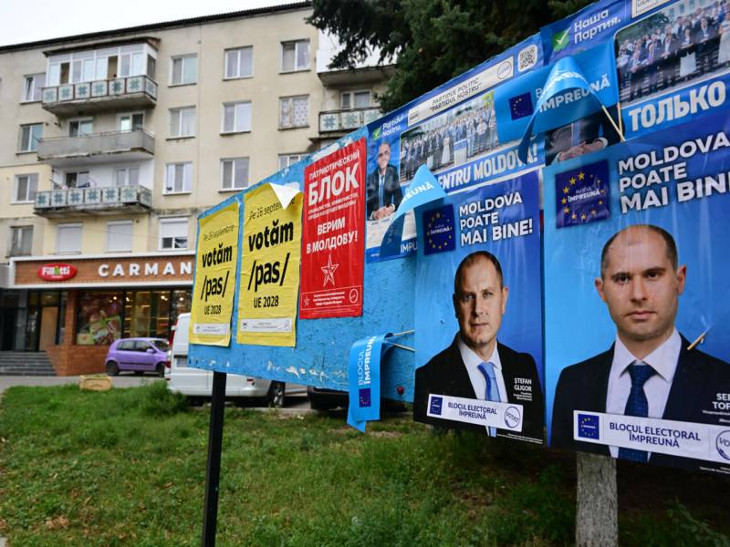 Moldovans vote in tense polls, torn between EU and Russia