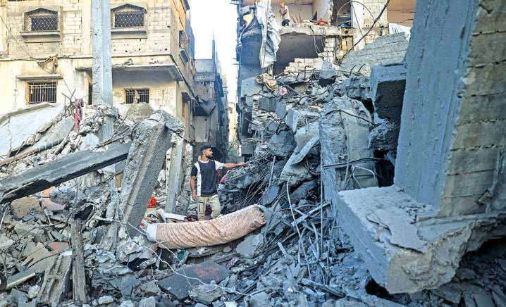 Hamas urges Israel to halt strikes as it searchs for two hostages