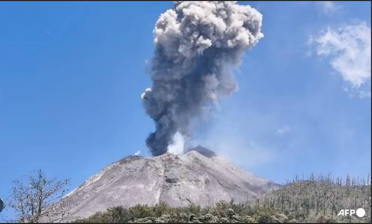Indonesia volcano erupts, belching ash into night sky