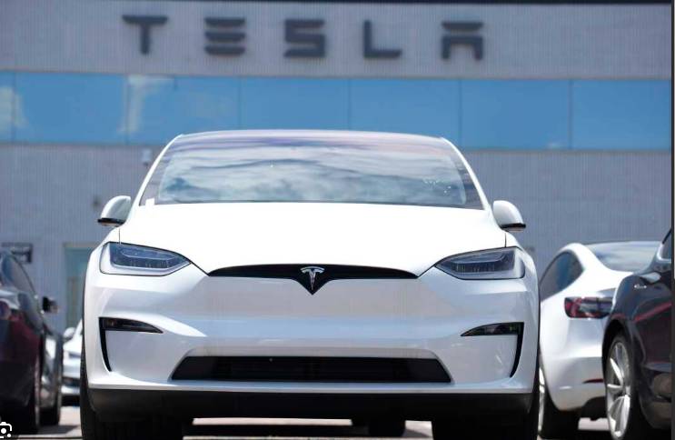 Tesla profits tumble on higher costs, tariff drag