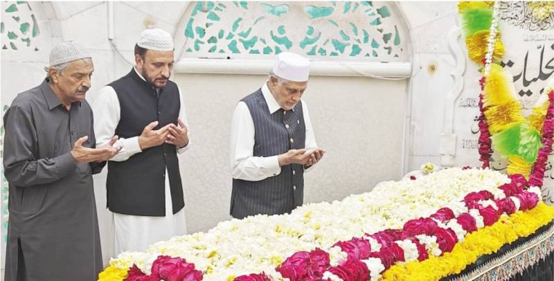Ishaq Dar visits Data Darbar, offers prayers for national stability