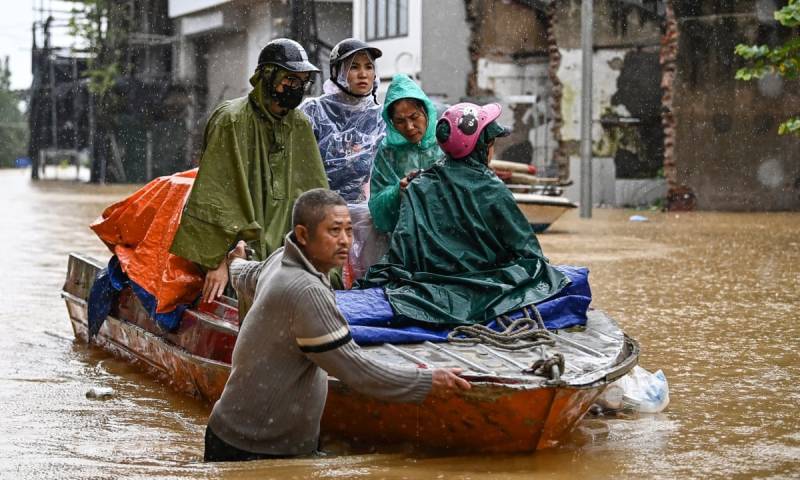 Record Vietnam rains kill seven and flood 100,000 homes