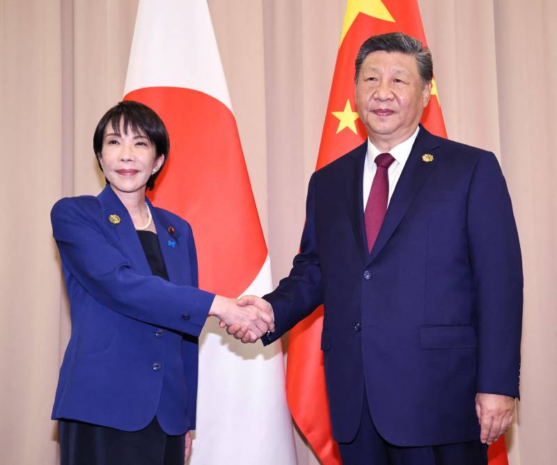 Japan PM says raised 'serious concerns' with Xi on South China Sea, Xinjiang
