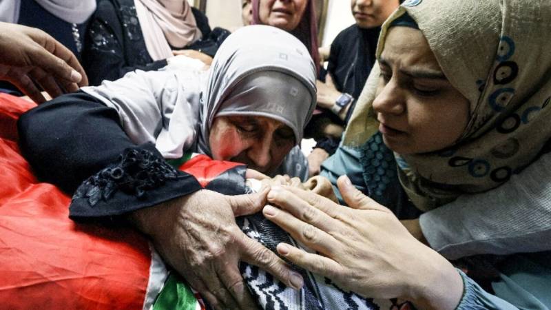 Palestinians bury 15-year-old shot by Israeli forces in West Bank