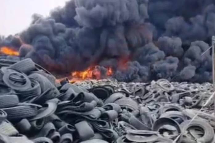 Pakistan Navy teams join fire-fighters in dousing fire at tyre warehouse in Karachi