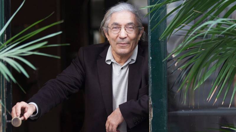 Novelist returns to France after imprisonment in Algeria