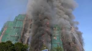 Fire engulfs Hong Kong residential blocks, killing at least 13