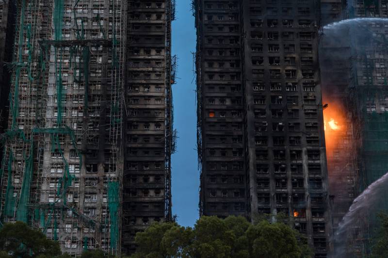 Hong Kong's deadliest blaze in decades kills at least 128, dozens missing