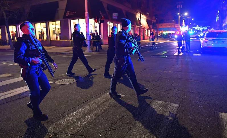 Police hunt gunman who killed two at US university
