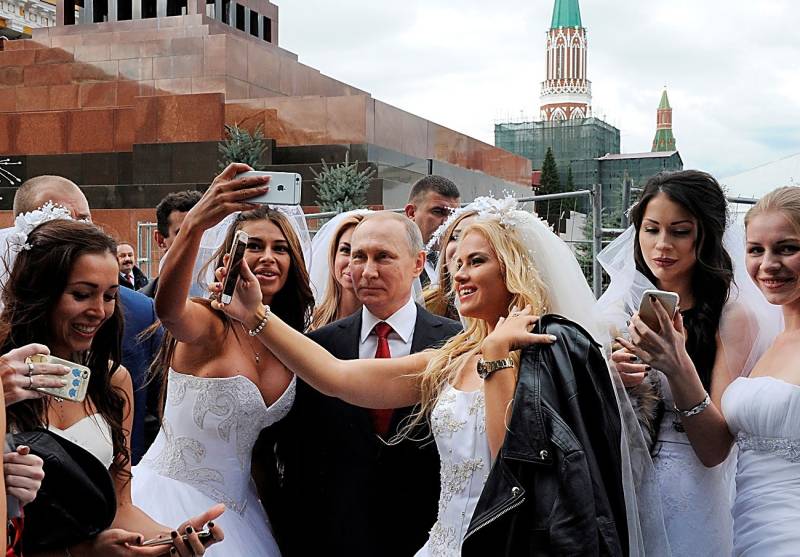 Putin's TV marathon: national costumes, marriage proposal and praise