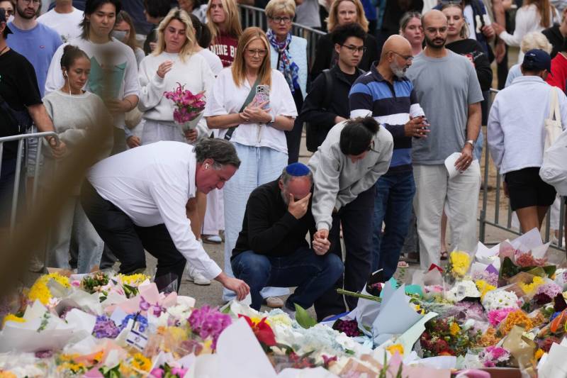 Australia falls silent, lights candles for Bondi Beach shooting victims