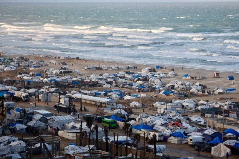 'Shivering from cold and fear': winter rains batter displaced Gazans