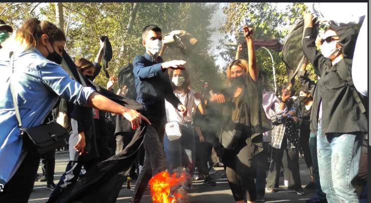 Iran security forces member stabbed, shot dead at protest