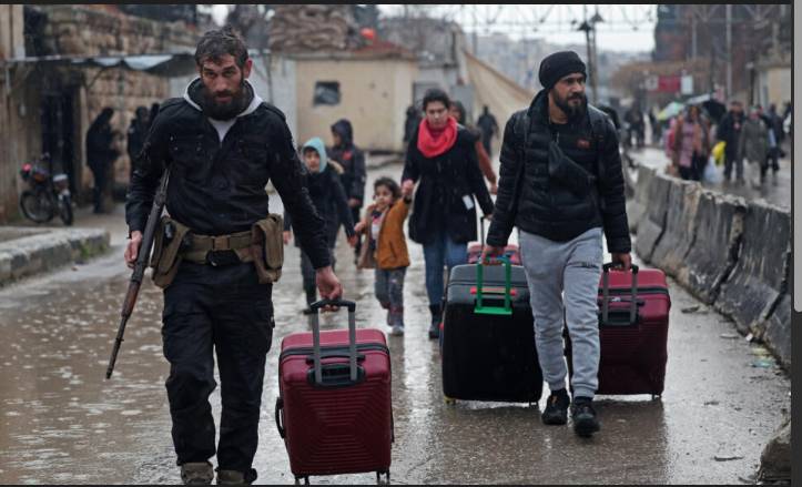 Syria urges Kurdish fighters to surrender after ramping up Aleppo operation