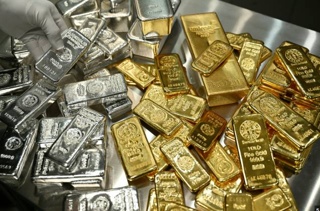 Gold, silver hit records as oil falls further