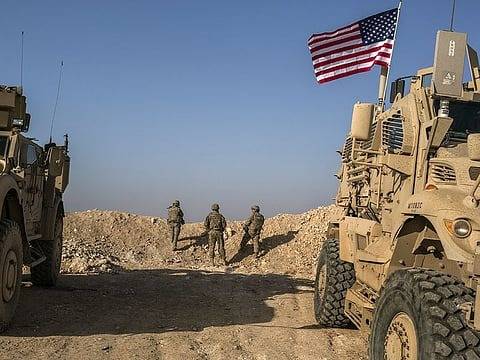 US pulls some personnel from Qatar as Iran warns of response to attack