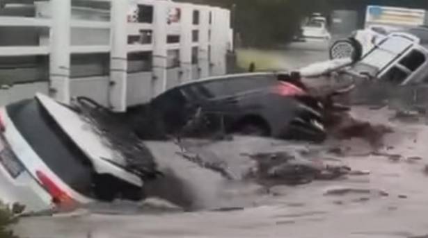 Australia warns of floods, fires after cars washed away