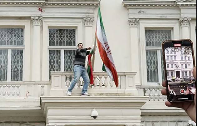 Protester arrested after climbing roof of Iran's embassy in London