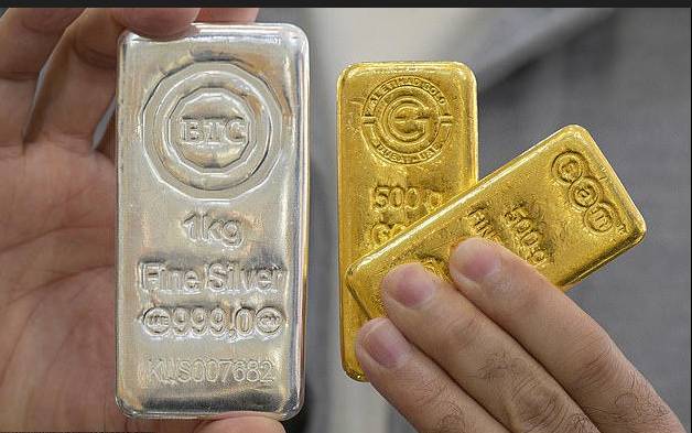 Gold nears $5,000, silver shines at record high