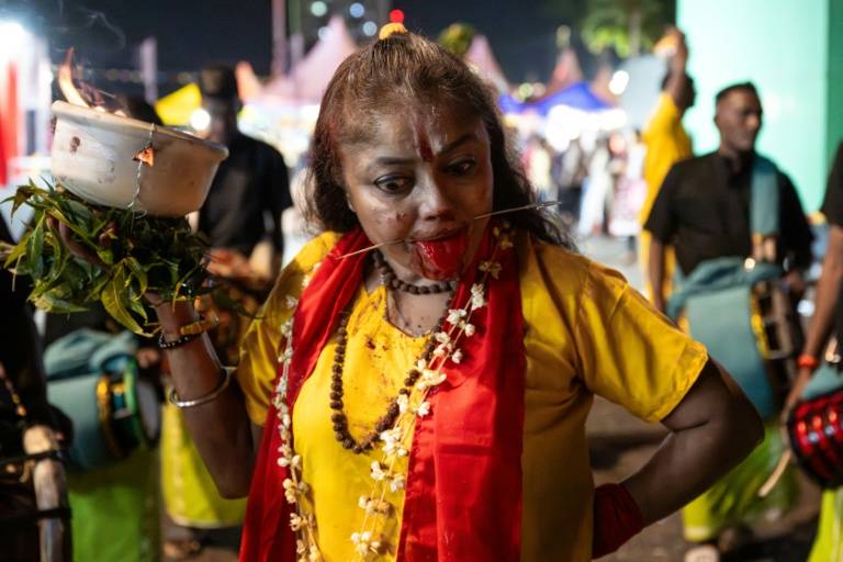 Sea of colour as Malaysia's Hindus mark Thaipusam with piercings and prayer