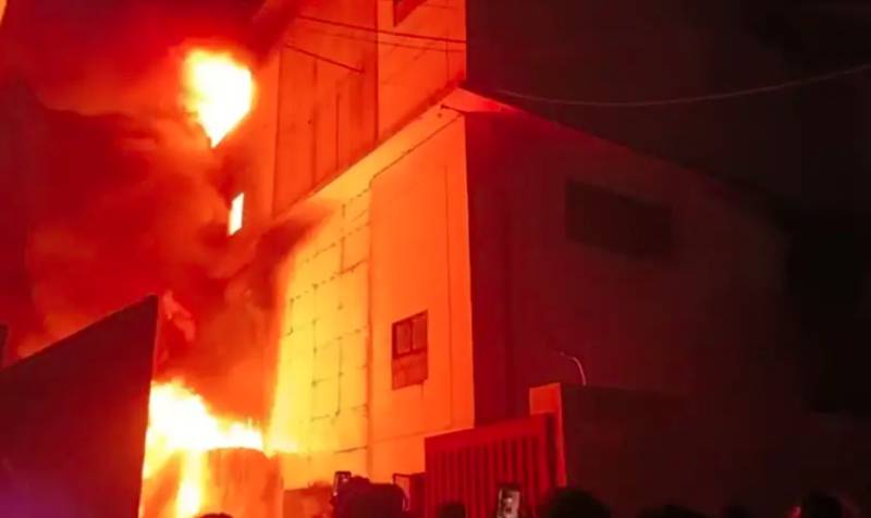 Fire-fighters strive to contain blaze which guts two factories, heading to third