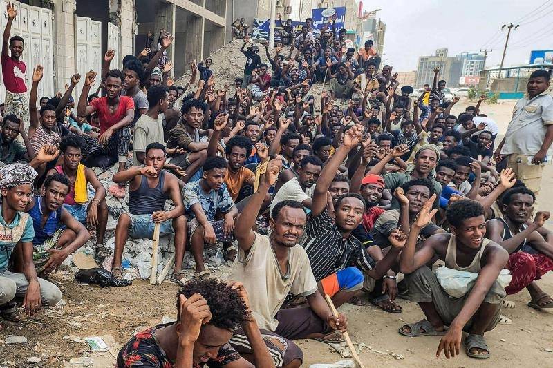 Fearful African migrants warily work on through Gulf missile strikes