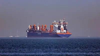 Ships brandish China-links to weave through Strait of Hormuz