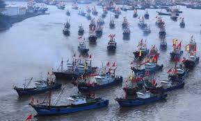 Thousands of Chinese boats mass at sea, raising questions