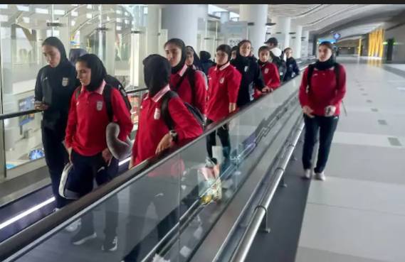 Iran women's football team feted in Tehran after asylum battle