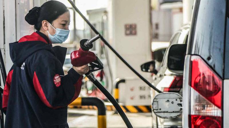 China limits fuel price hikes as oil costs surge
